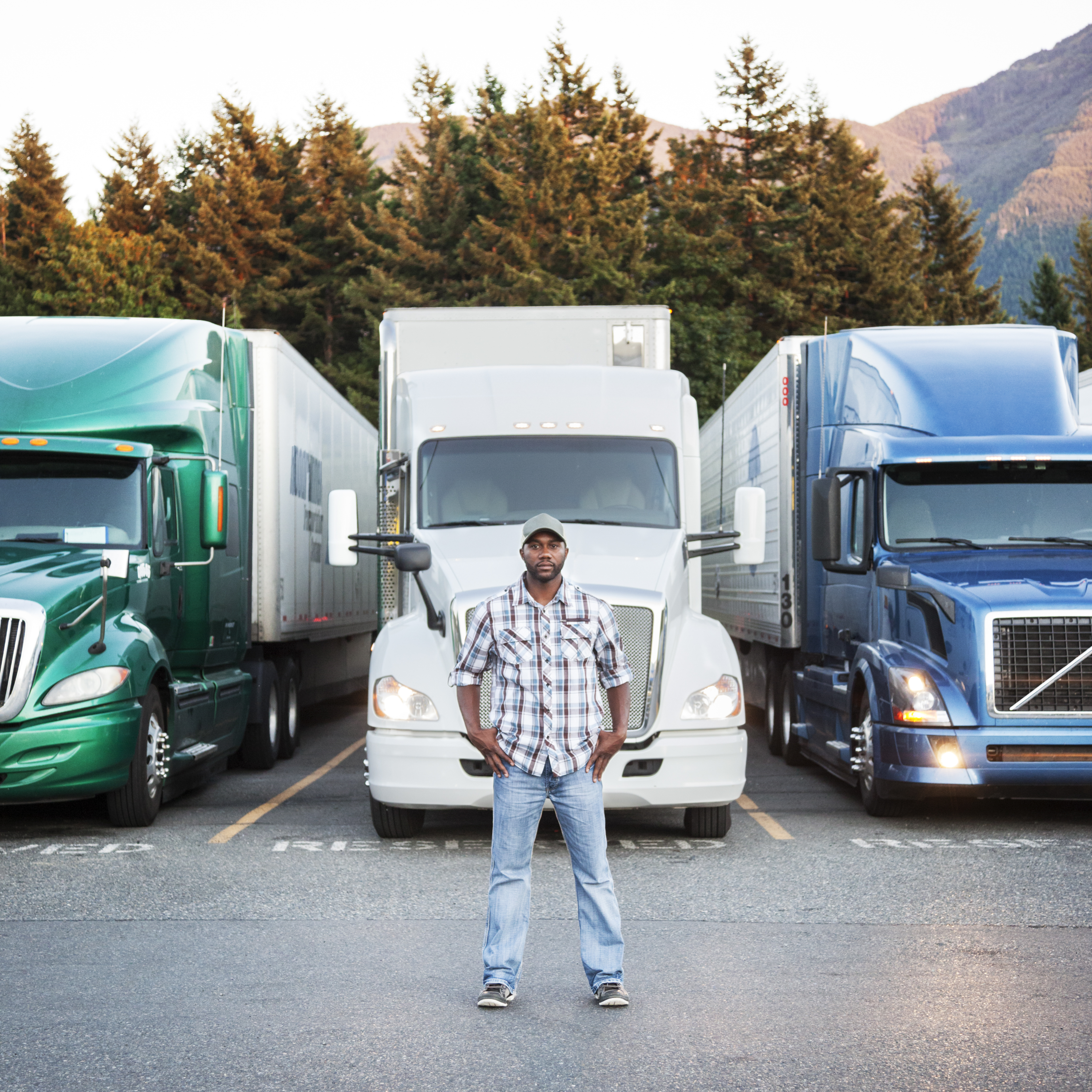 Truck driver by his vehicle